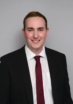 University of Worcester logo on a light blue background