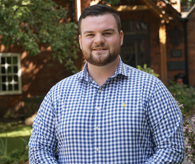 bearded man with white and blue check shirt