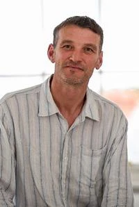 University of Worcester logo on a light blue background