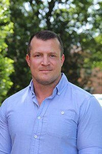 University of Worcester logo on a light blue background