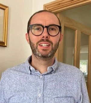 University of Worcester logo on a light blue background