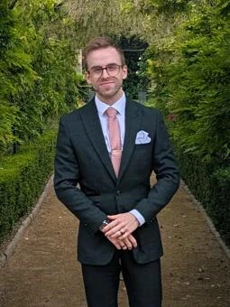 University of Worcester logo on a light blue background