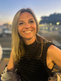A woman smiling at the camera