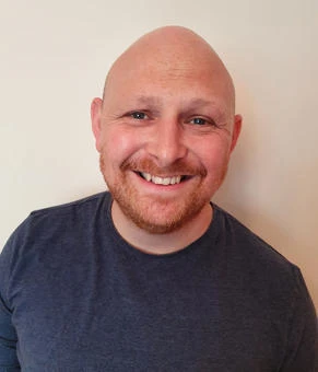 University of Worcester logo on a light blue background