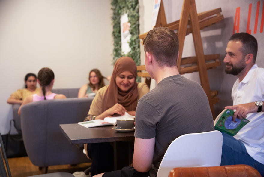 Students socialsing in a cafe space on campus