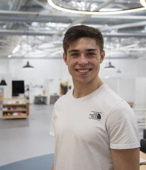 University of Worcester logo on a light blue background