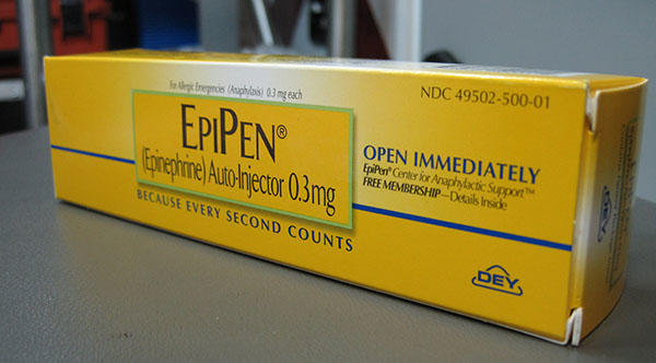 A close up picture of an Epi-Pen in a yellow packet