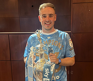 Man holding trophy