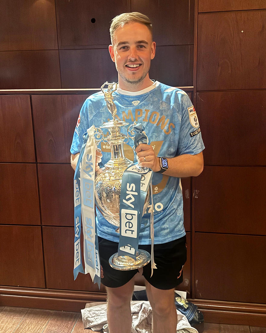 Man holding trophy