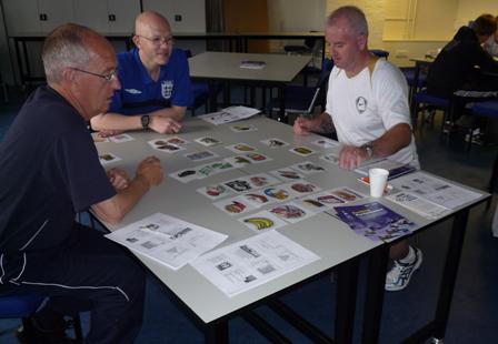 Lecturers in nutrition converse at a table