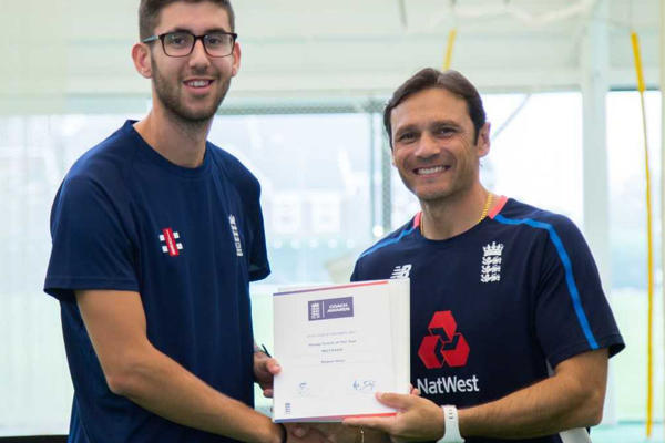 Rob Horn receiving his award for young coach of the year from former England Batting Coach Mark Ramprakash