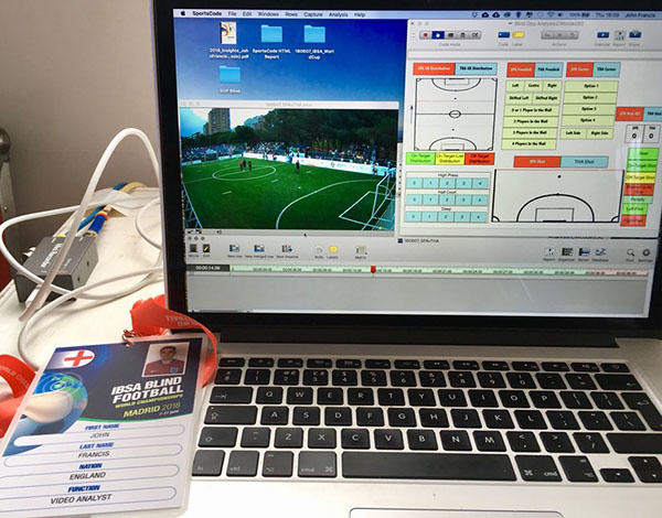 A clost up picture of sports analysis software next to an ID badge for the Blind Football Championships