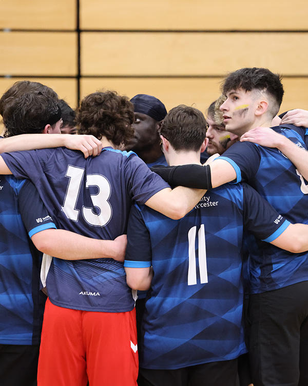 Sportspeople in a huddle