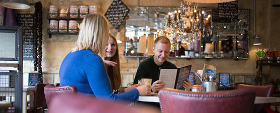 Students socialise in a coffee shop