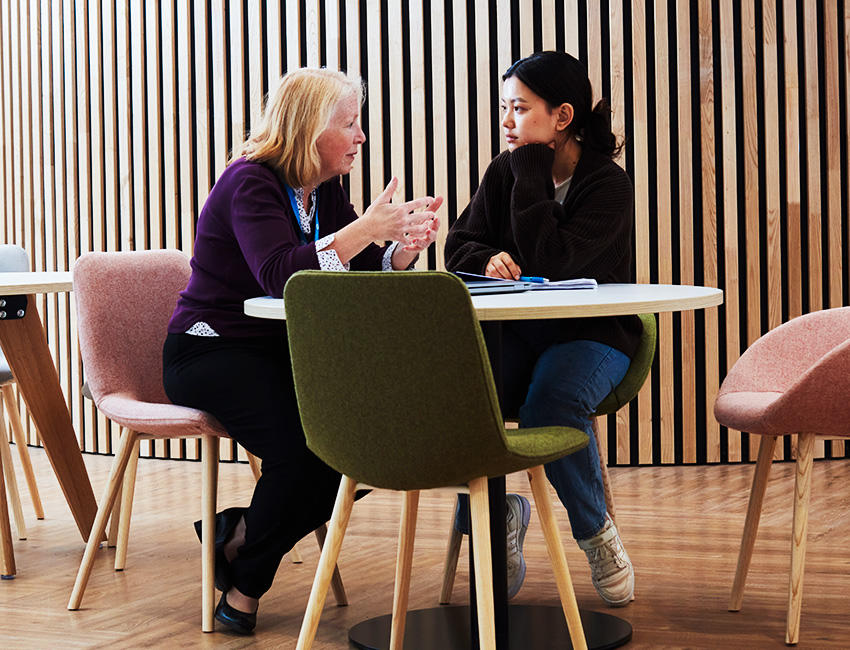 Student receiving feedback from lecturer