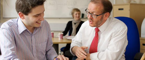 A lecturer helping a mature student