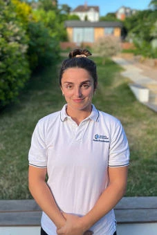 University of Worcester logo on a light blue background