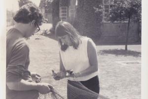 Two people holding a net in the 1960s