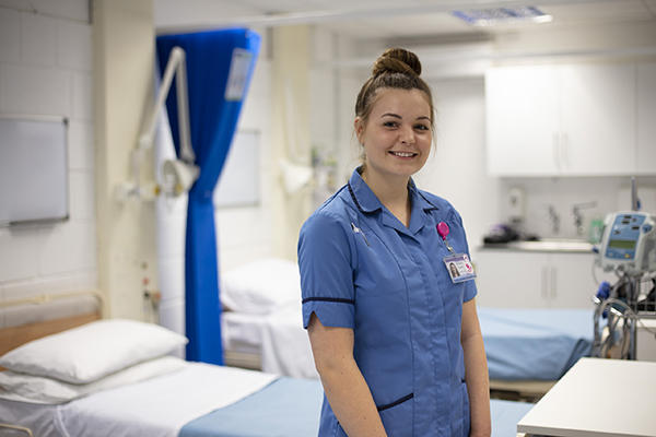 Nurse standing in hospital ward