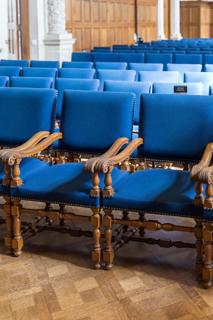 A room filled with blue chairs