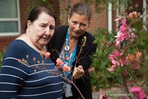 Two ladies are talking one is wearing a University of Worcester lanyard