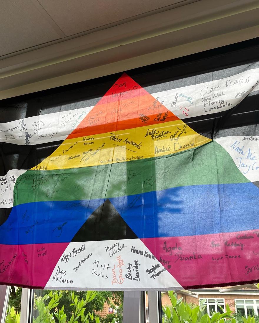 LGBTQ+ allies flag signed by members of staff