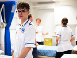 male nursing student smiling in the simulation centre