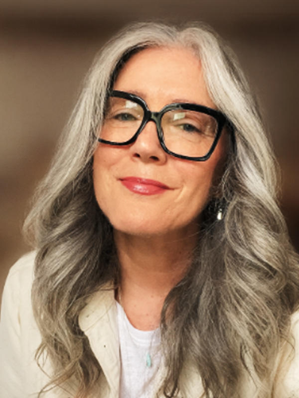 a woman smiling at the camera