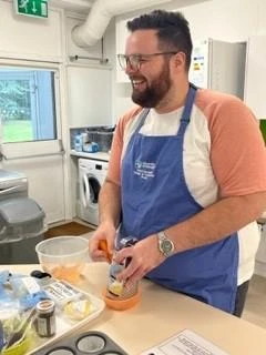 University of Worcester logo on a light blue background