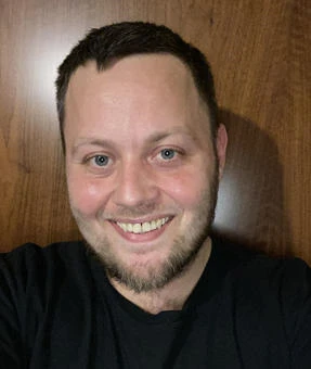 University of Worcester logo on a light blue background