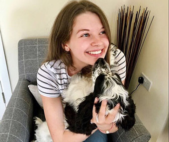 University of Worcester logo on a light blue background