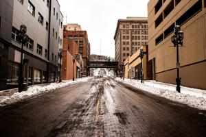A photo of an empty road with snow on the pavements in Duluth Minnesota