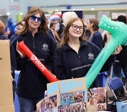 two swim committee members at welcome fair
