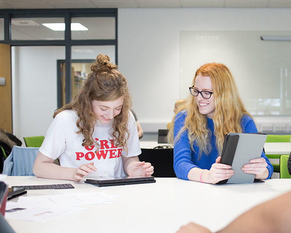 University students using tablets in the classroom