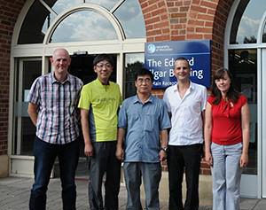 Five people standing outside the edward elgar entrance