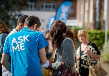 A student helps Open Day attendees