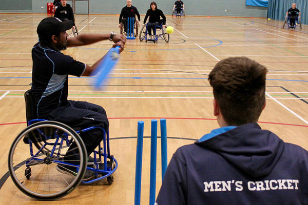 a group of students are playing wheelchair cricket at the University of Worcester