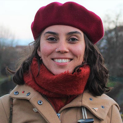 Portrait photo of Erica in a red hat and scarf