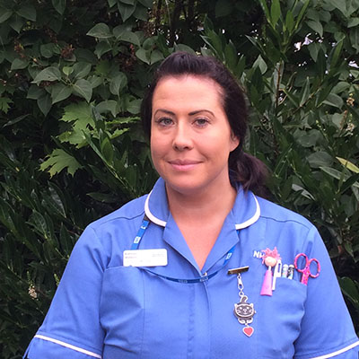 Woman in a blue nursing uniform