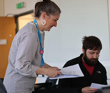 a lecturer is talking to a student