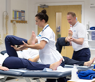 Physiotherapy students with their patients in a clinic environment