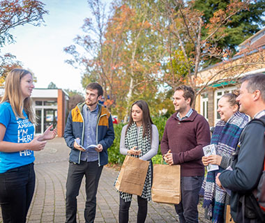 A student Ambassador is giving a talk to several prospective students