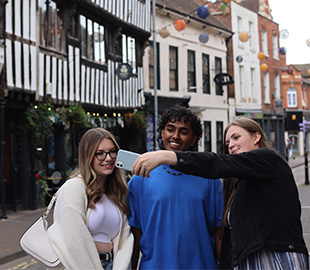 Three students taking a selfie in Friar Street