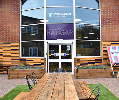 The outside of the Students' Union surrounded by flowers and benches