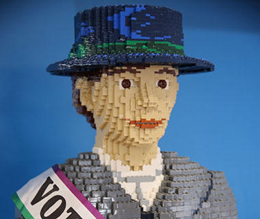 A close up shot of a Suffragette made of Lego