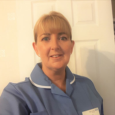 Portrait of a mature woman in a blue nurses uniform