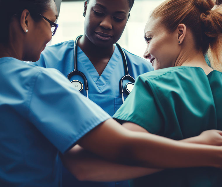 Close-knit medical team huddling together in a show of unity and support