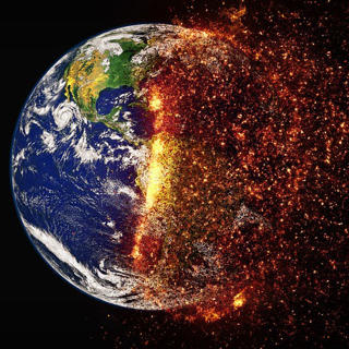 Globe half covered in red dust