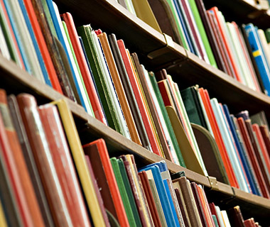 Shelves full of colourful books