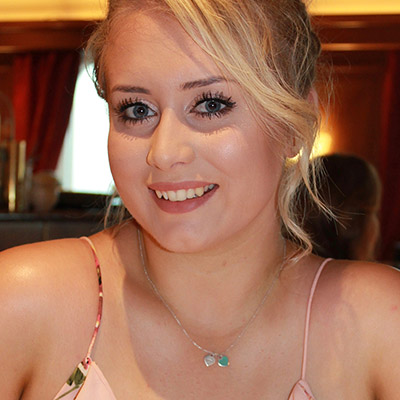 Blonde young lady smiling